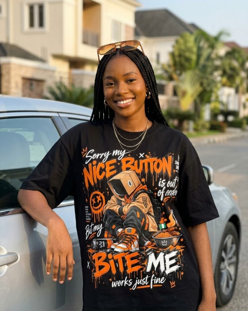 Bite Me Works Just Fine oversized graphic tee worn in Abuja streetwear look — Shakara Drip